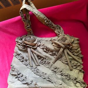 Alexia Crawford silk purse for women of distinction. Rosettes and ruffles.